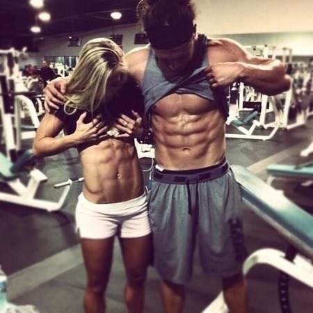 Fitness Couple Showing Muscles
